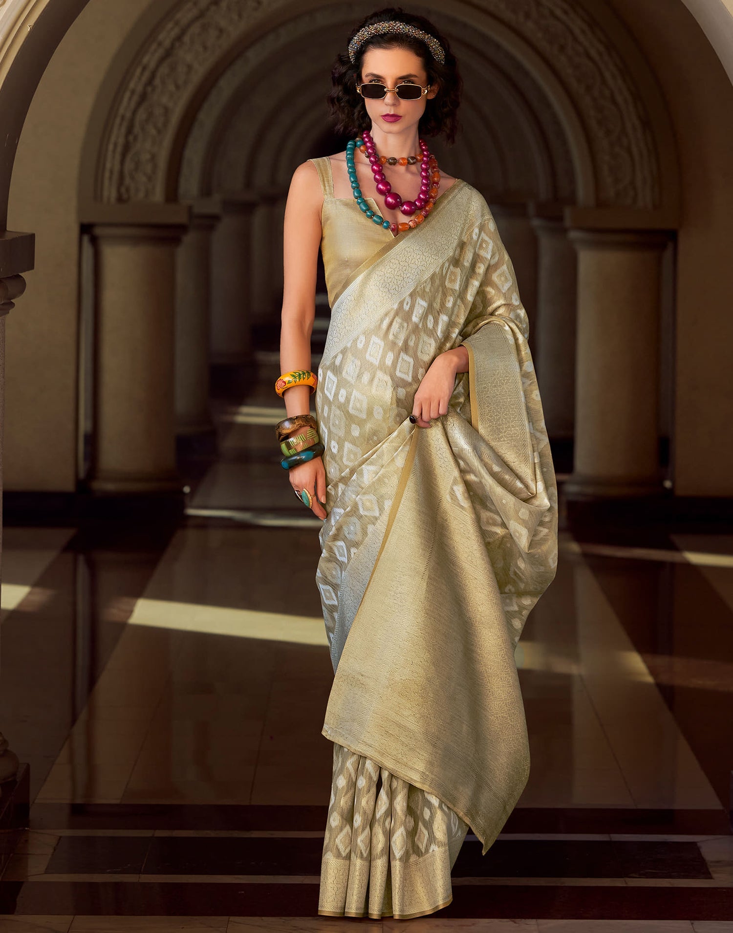 Goldmine Ivory Tissue Silk Weaving Saree