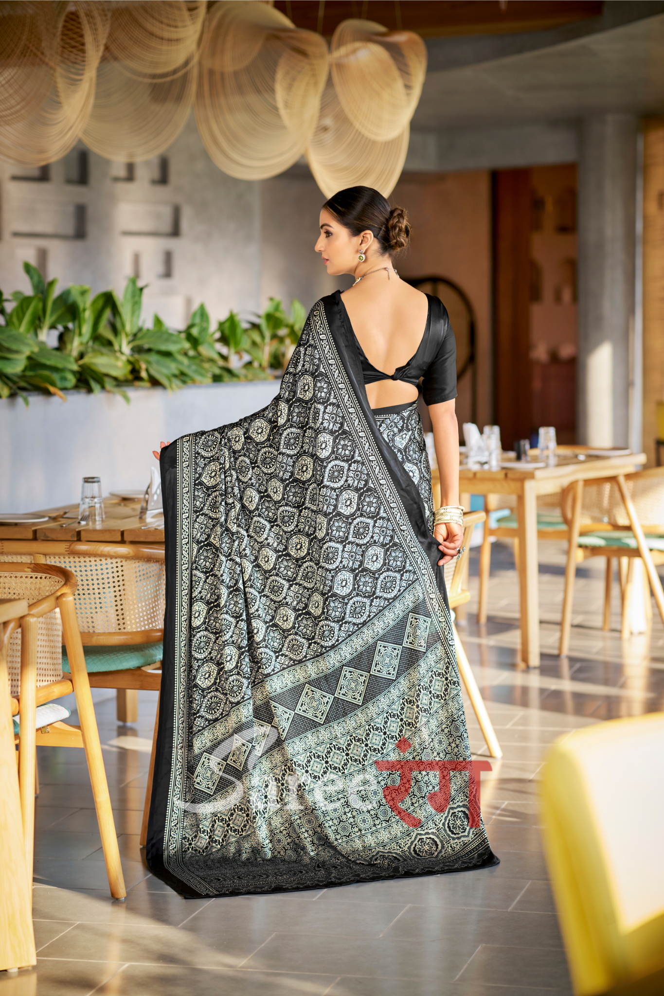 Varnika Black Modal Silk Ajrakh Natural Print saree.