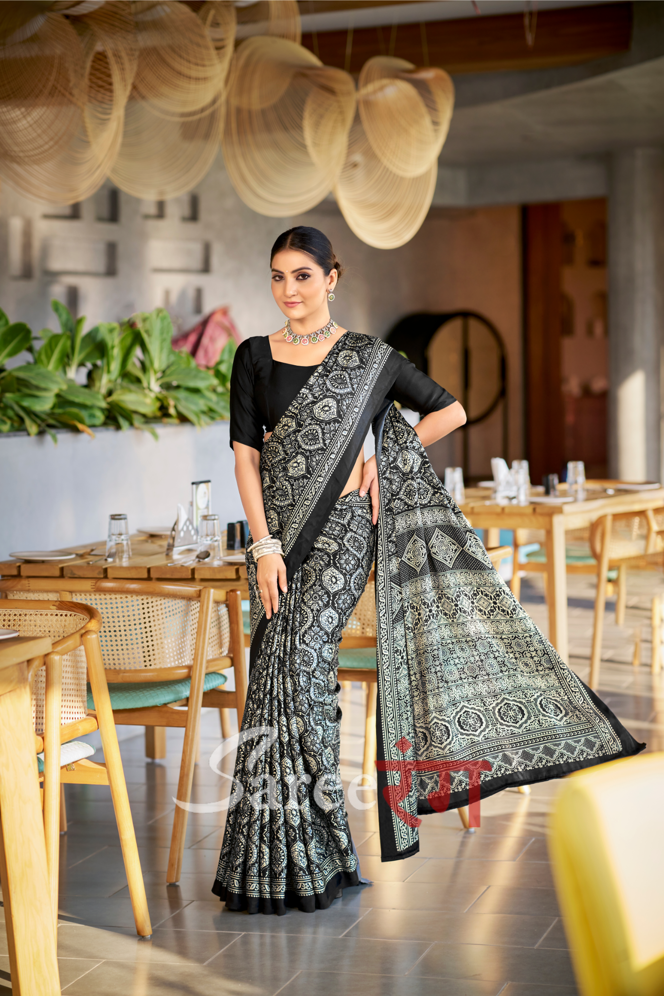 Varnika Black Modal Silk Ajrakh Natural Print saree.