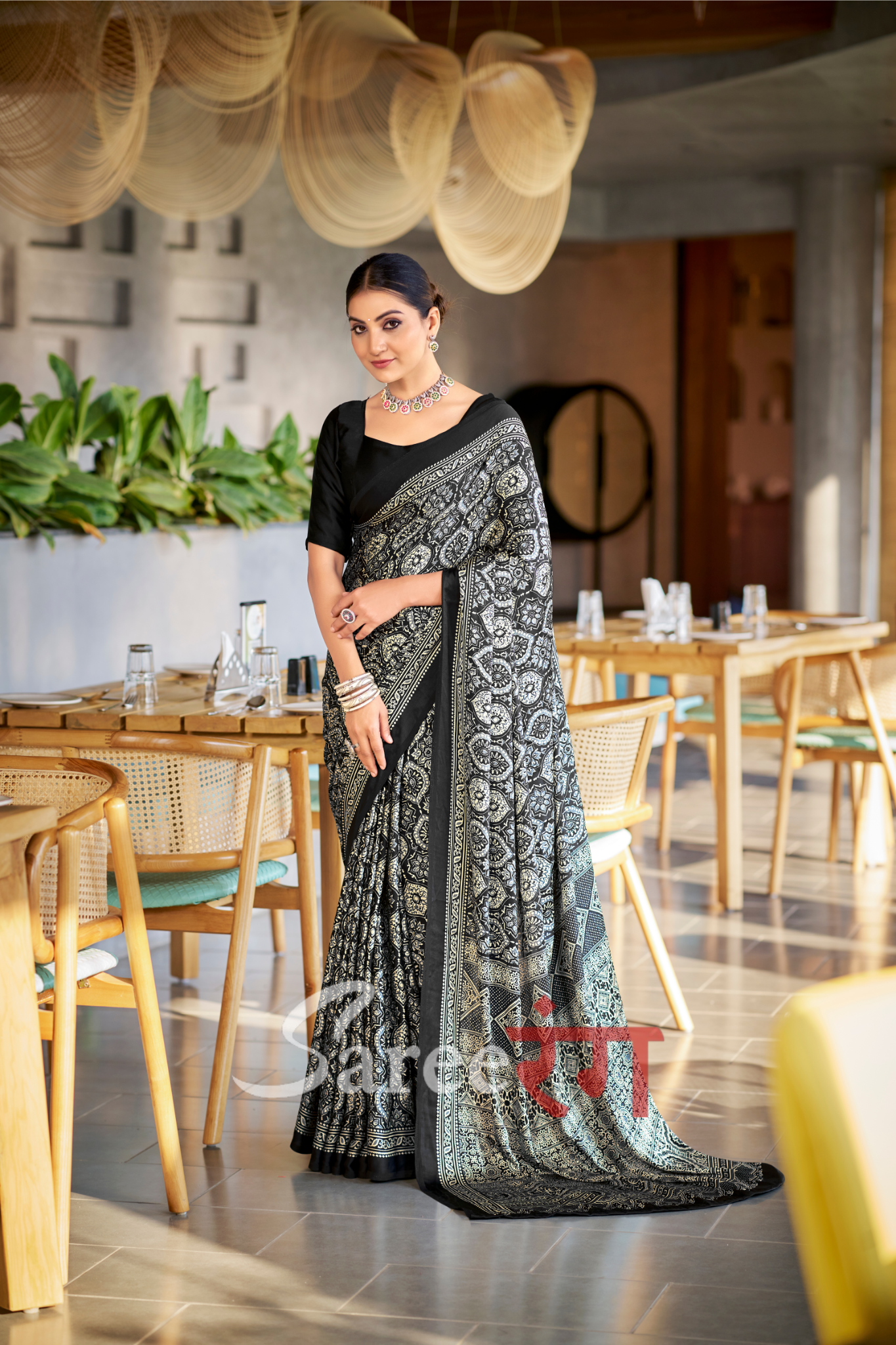 Varnika Black Modal Silk Ajrakh Natural Print saree.