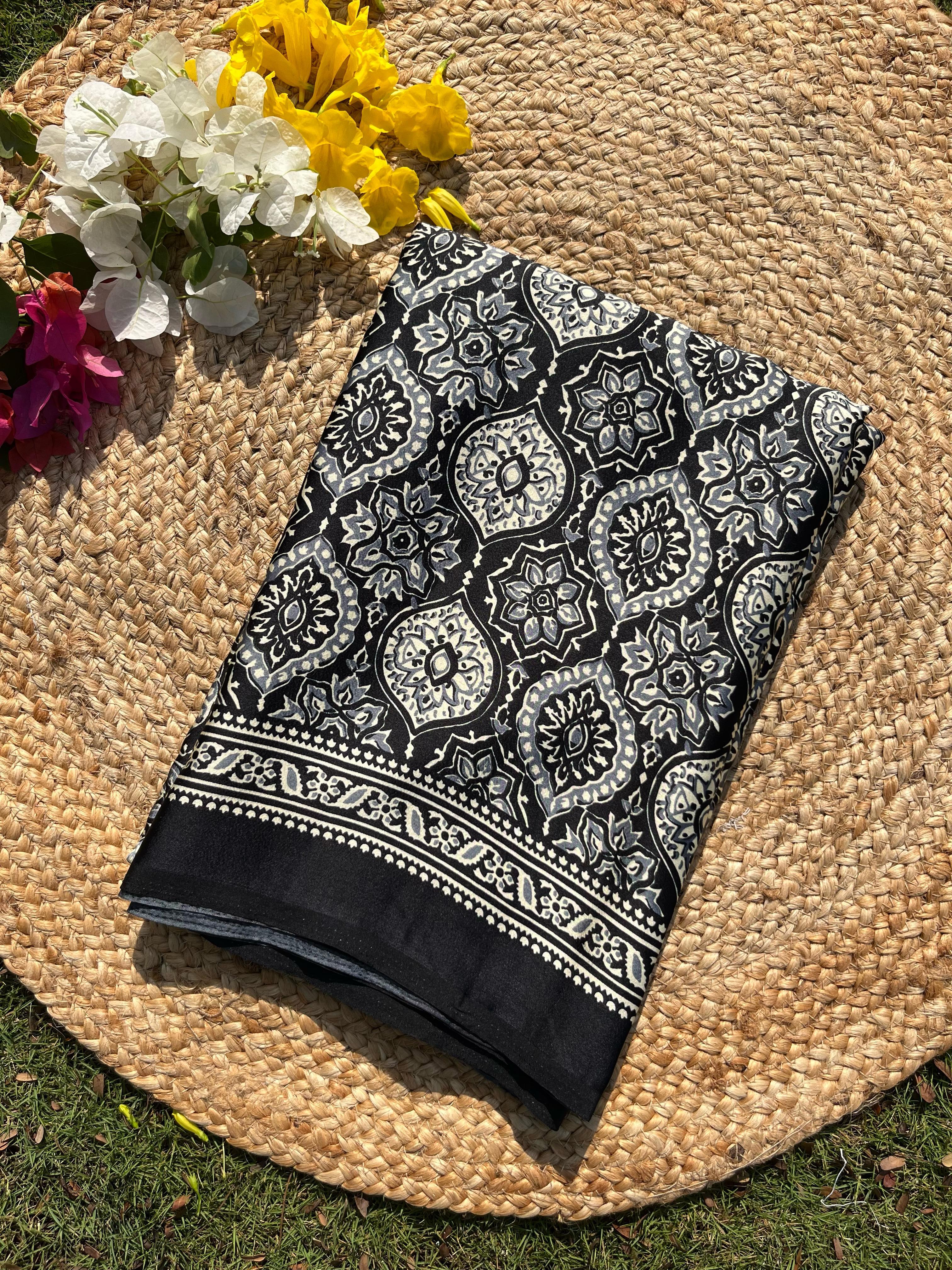 Varnika Black Modal Silk Ajrakh Natural Print saree.
