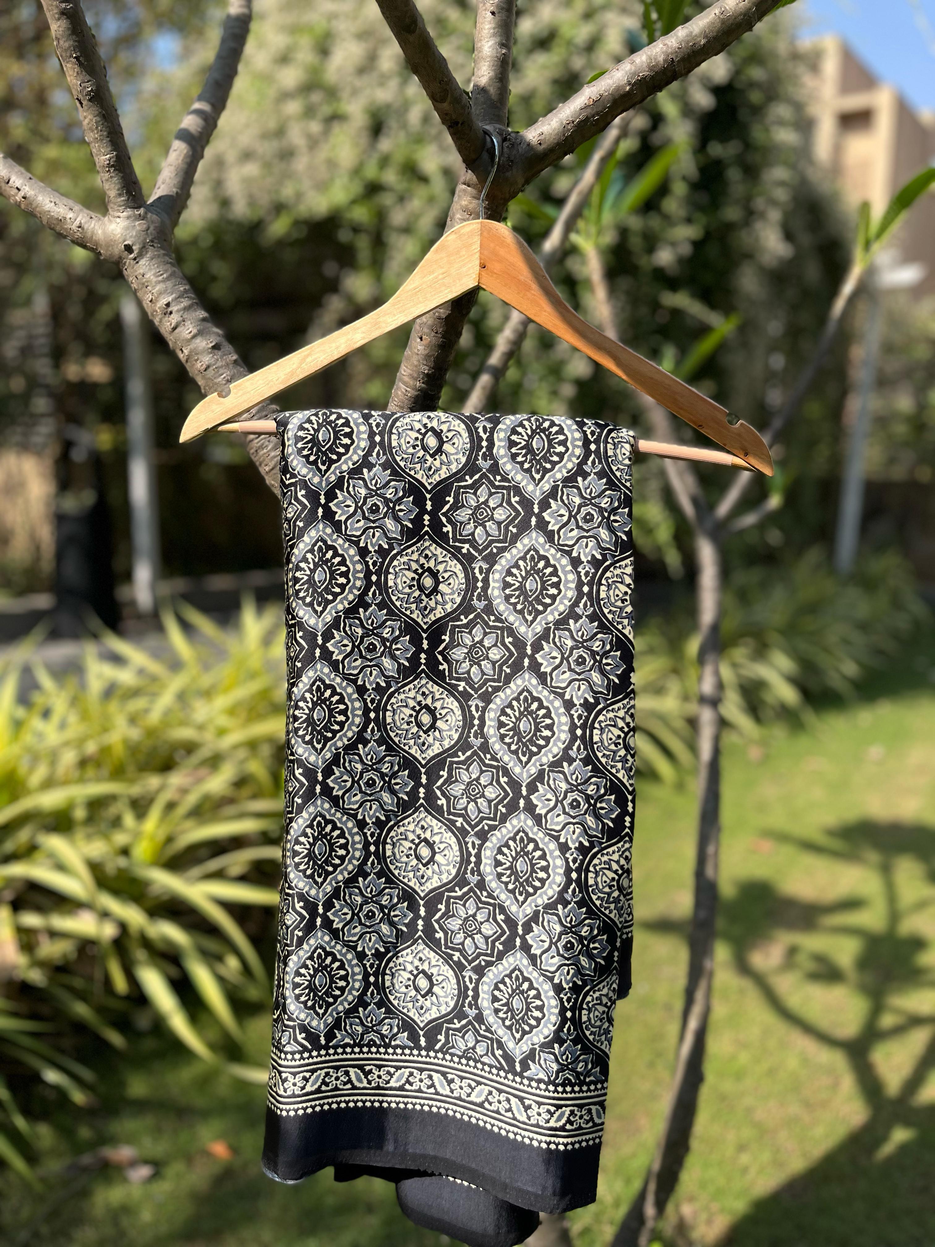 Varnika Black Modal Silk Ajrakh Natural Print saree.